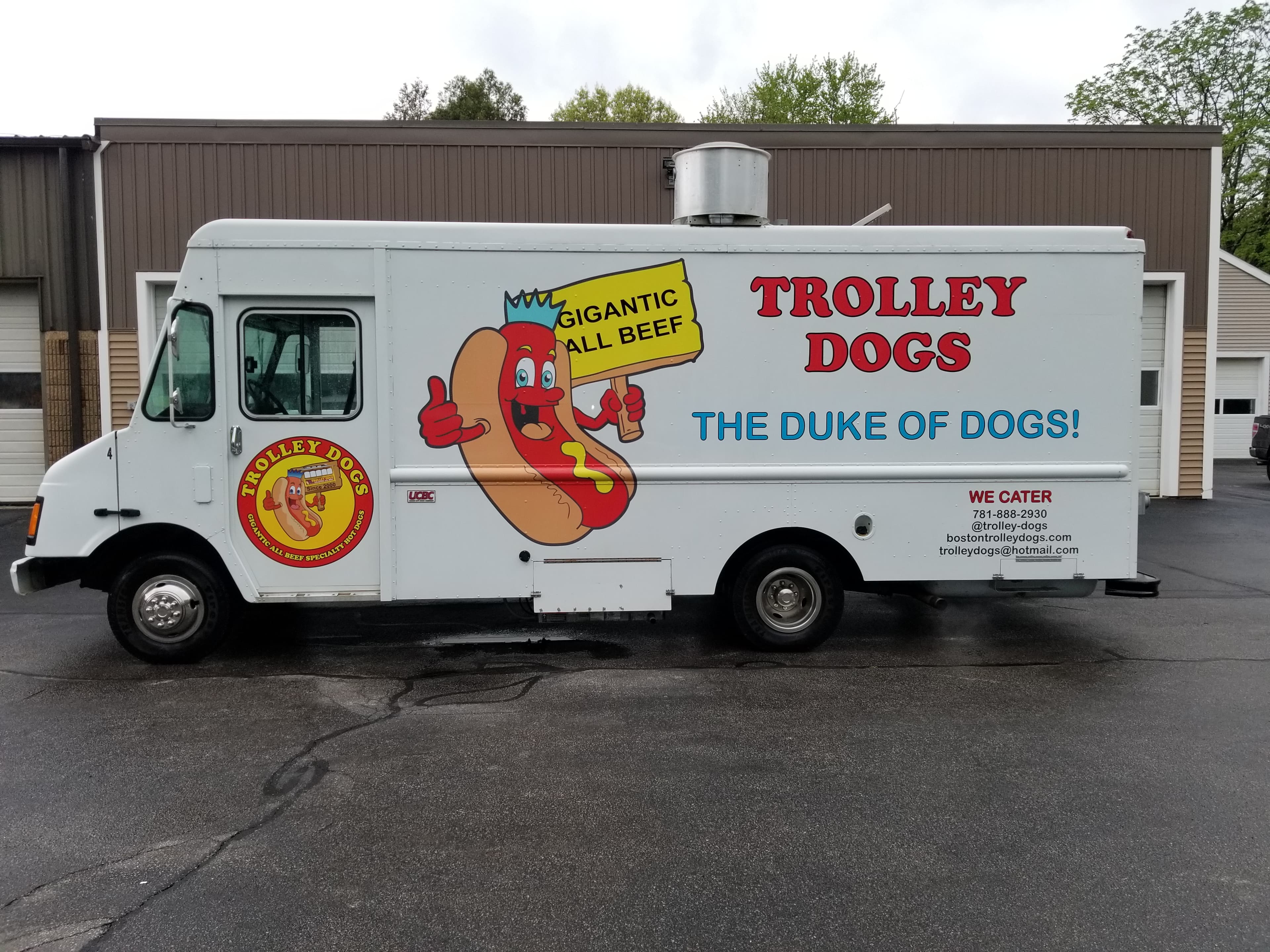 Trolley Dogs white food truck at an event